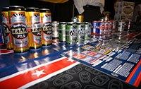 Variations of Oskar Blues Beer in Cans on table