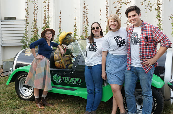 My Athens representatives posing next to Terrapin Beer Co. car