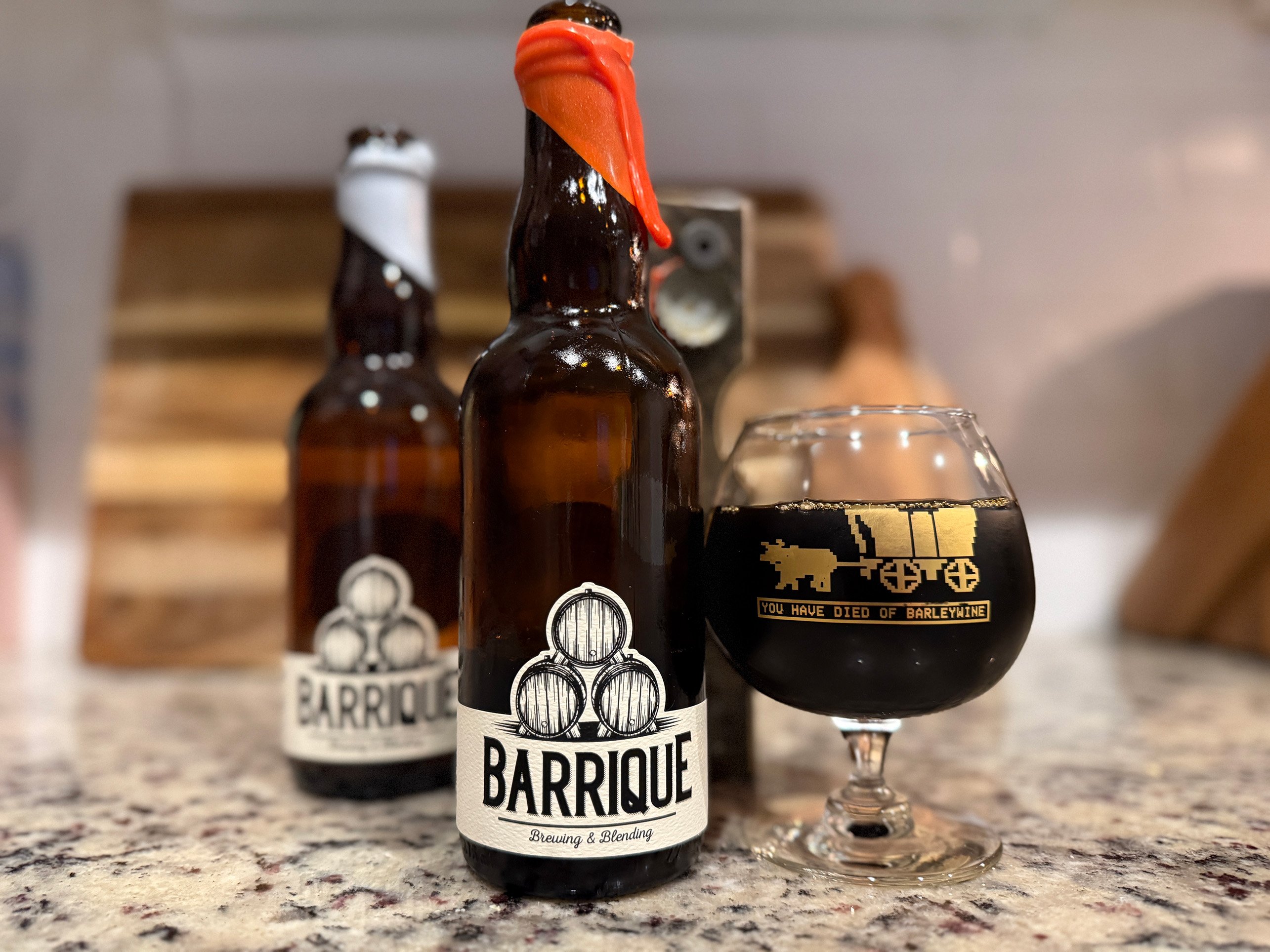 Time Waits for Nothing Belgian Barleywine review. Glass to Mouth barleywine snifter, Echo in the Void bottle in the background