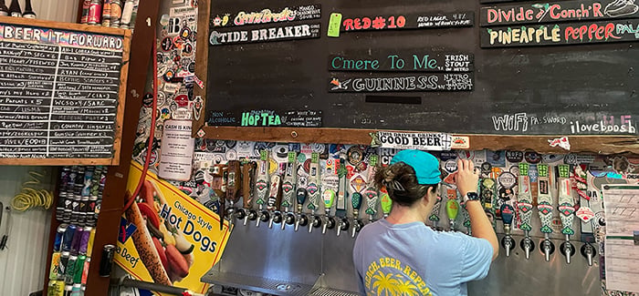 A beertender pours a pint at Idyll Hounds in Florida's Panhandle.