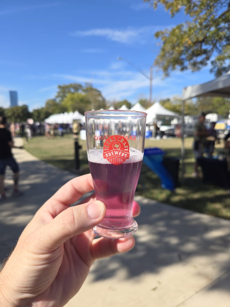 Attendee of the festival holding a tasting glass