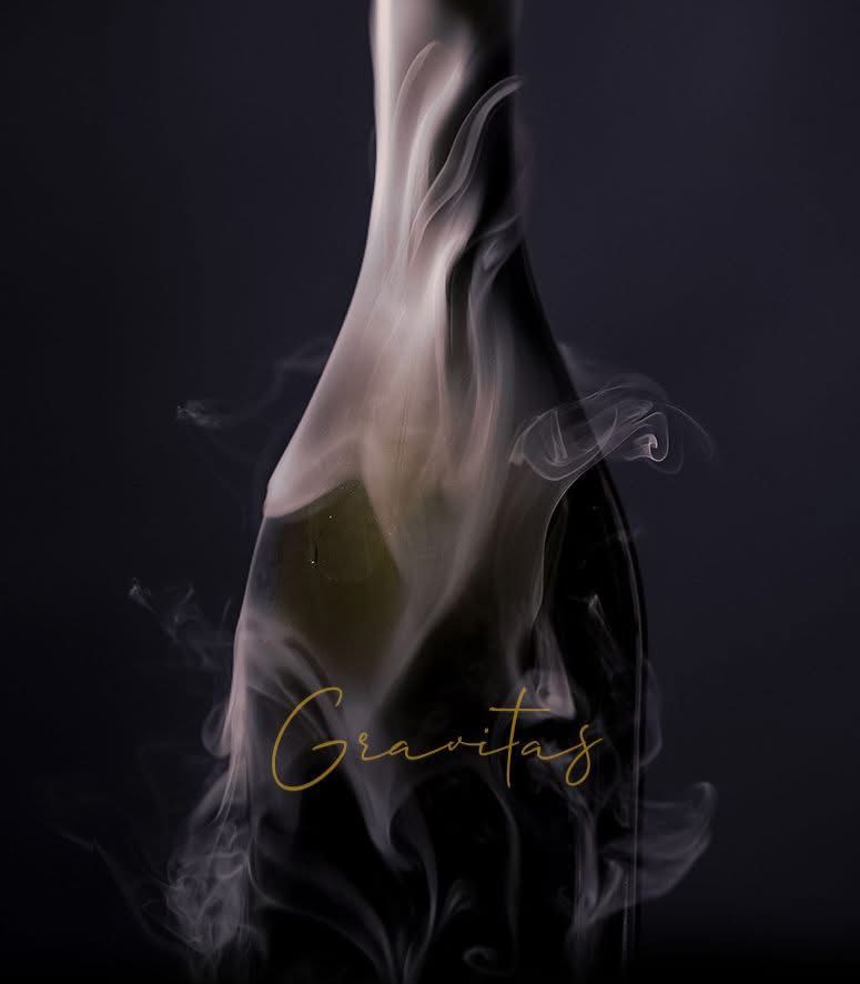 The gravitas series by bravus brewing co. surrounded by hazy smoke