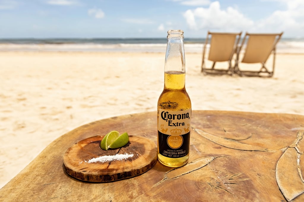 Bottle of Corona Extra on beach in Tulum, Mexico