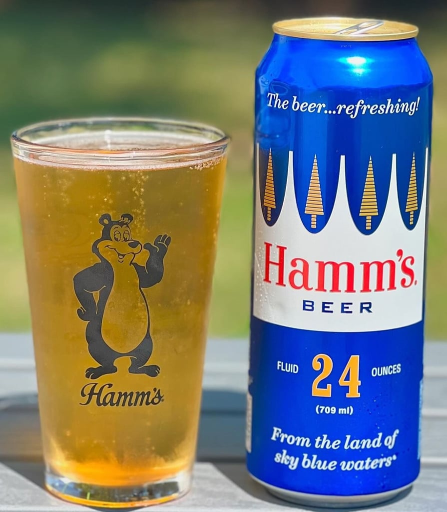 24-ounce can and glass of Hamm's beer with its bear logo