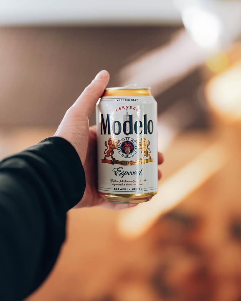 person holding can of modelo especial, the best cheap mexican beer