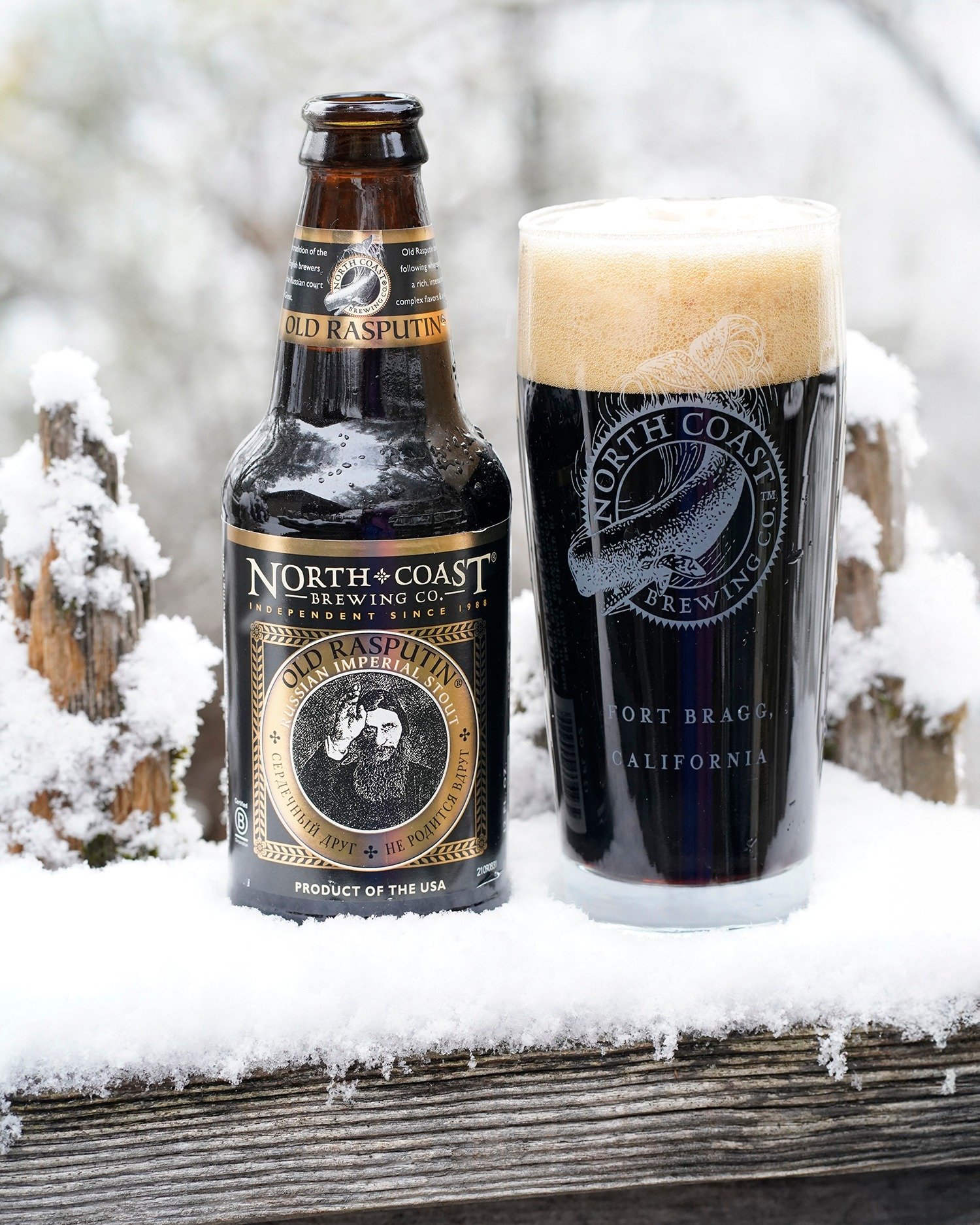 North Coast Old Rasputin Russian Imperial Stout bottle and glass in the snow.