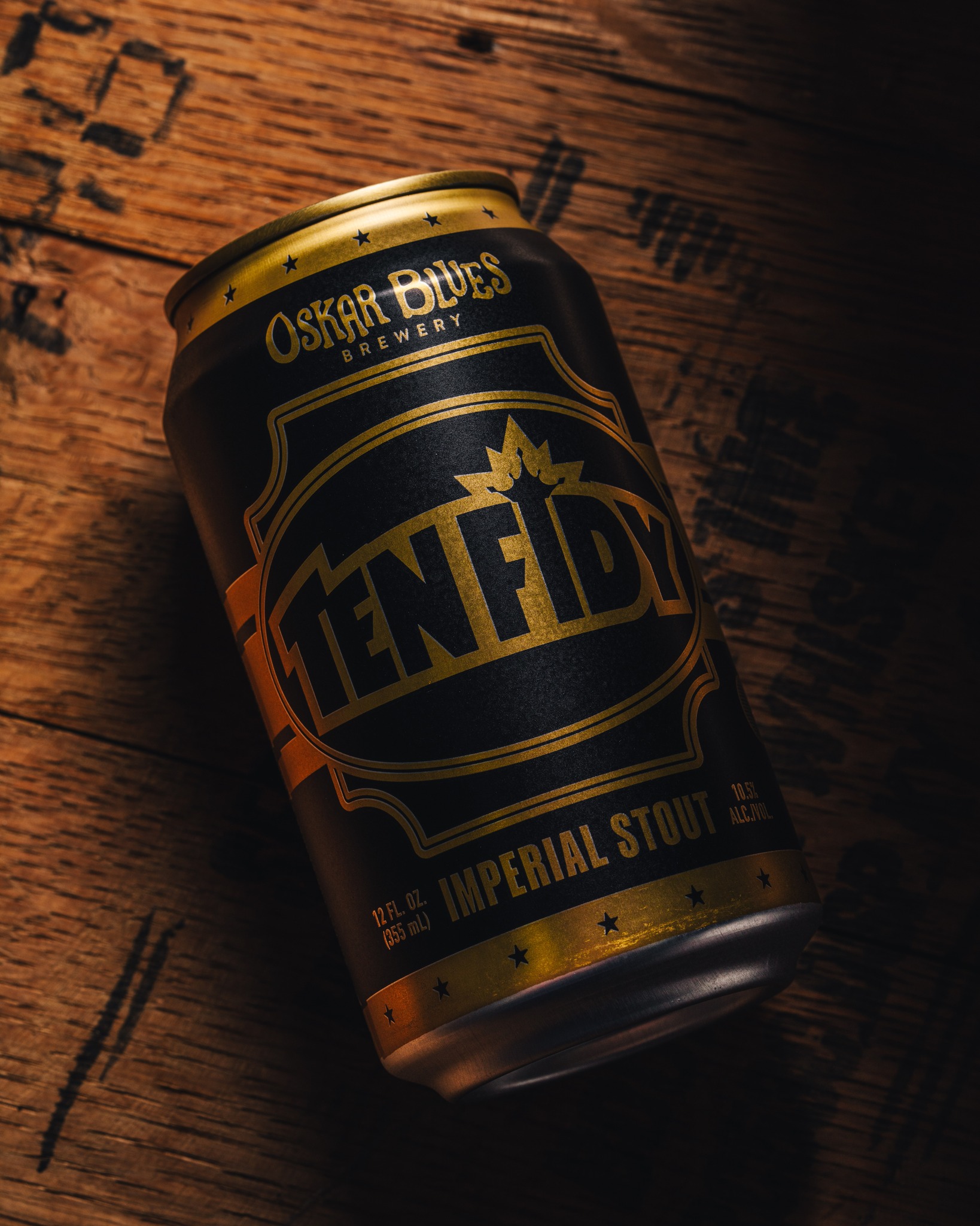 Oskar Blues Ten FIDY can atop barrel.