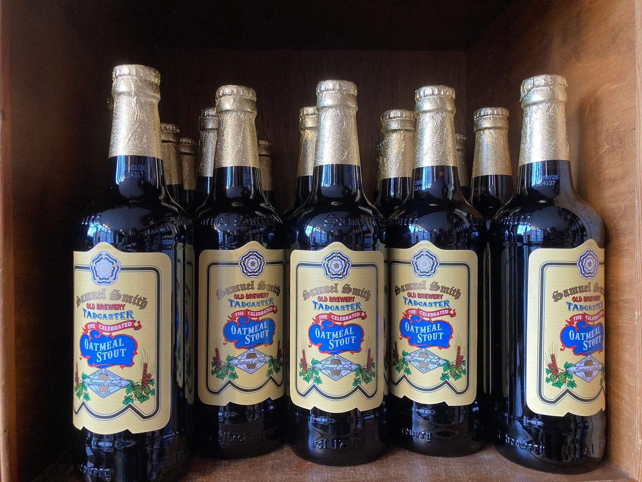 Collection of Samuel Smith oatmeal stout bottles.