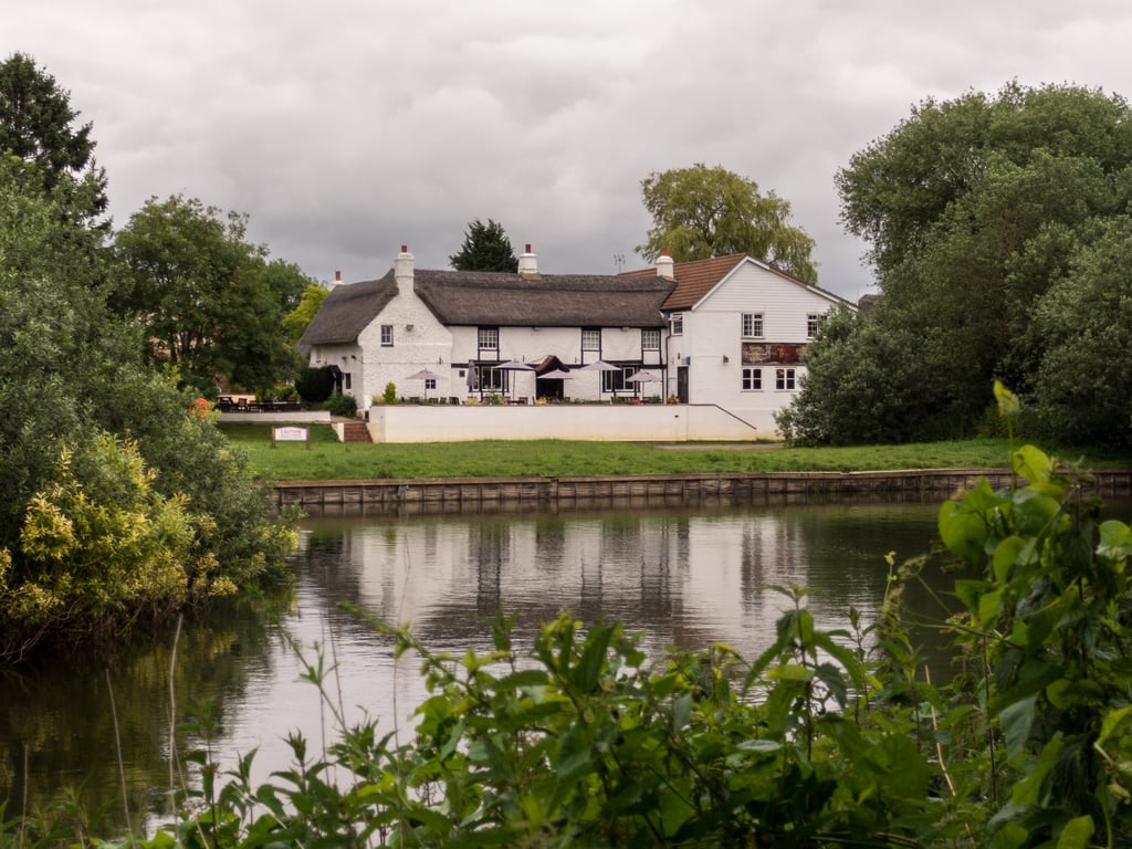 Exterior of The Old Ferry Boat Inn, as viewed from across the water.