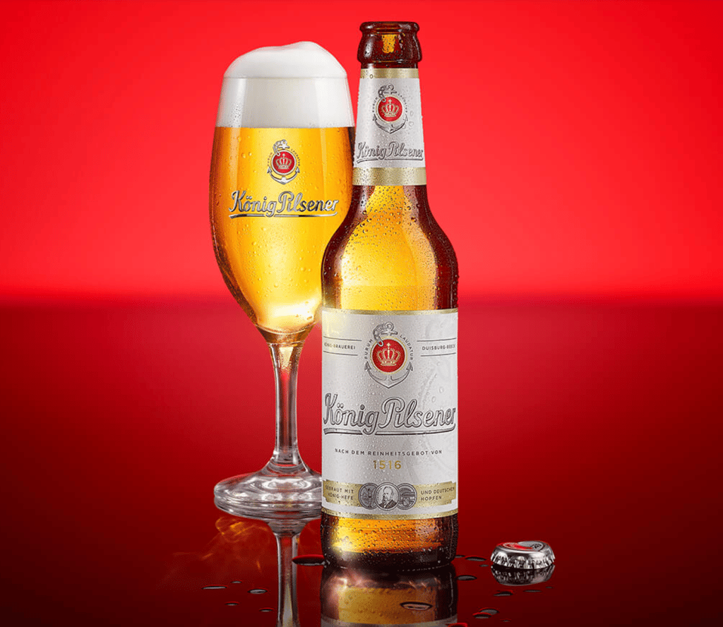 König Pilsener beer bottle and glass.