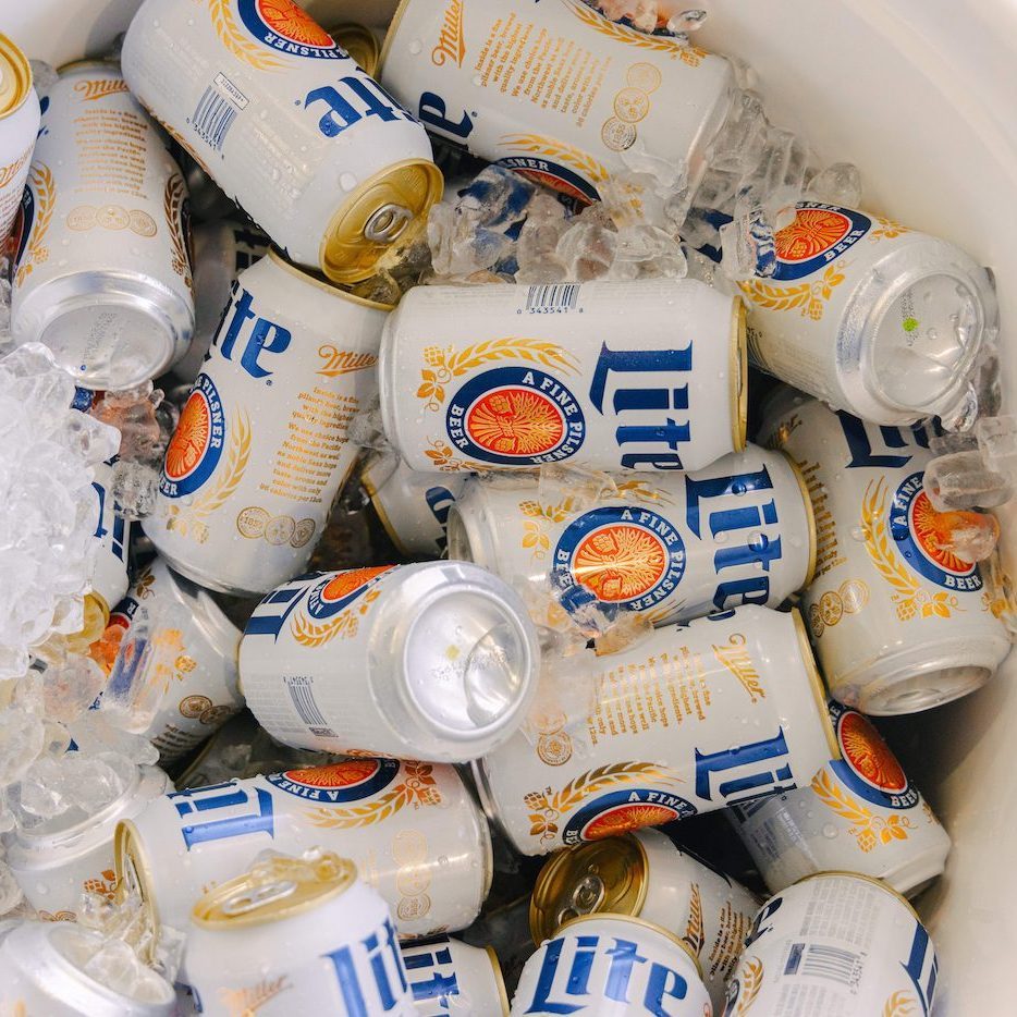 miller lite cans in ice-filled cooler