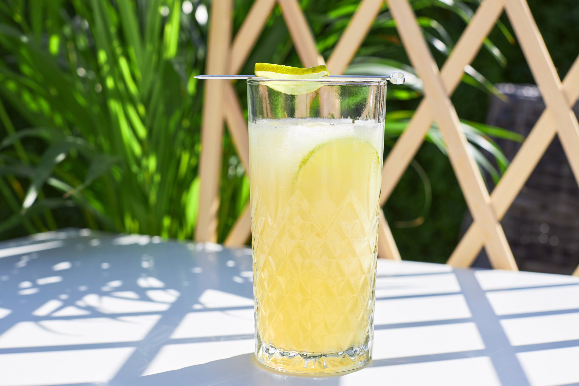 A glass of porch crawler/porch climber outdoors, ready to be enjoyed as a porch drink.