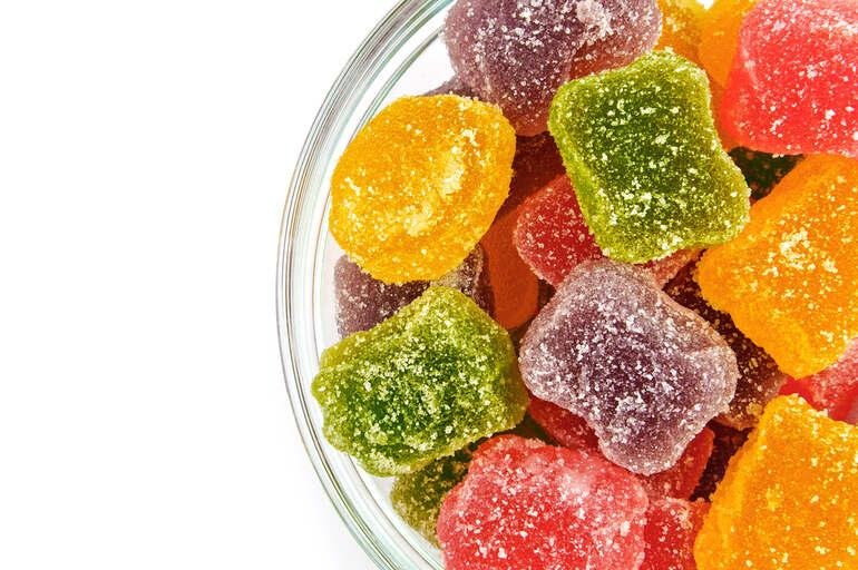Bowl filled with sleep gummies, highlighting key considerations beer drinkers should keep in mind when choosing supplements.