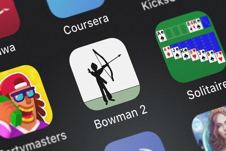 Smartphone screen displaying mobile apps, including a browser-based game, illustrating the rise of digital entertainment options beyond drinking in a mobile-first world.