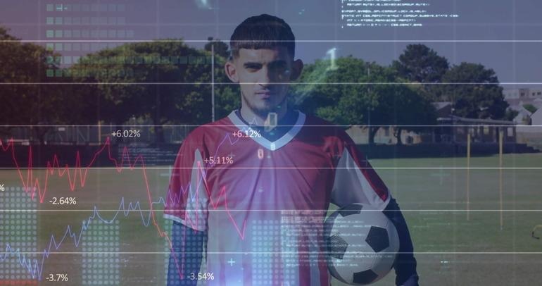 Football player with digital data overlays, showing the impact of online platforms on sports culture in Iraq.
