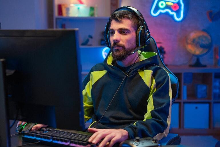 Gamer playing a video game while exploring loot rewards and randomized drop mechanics.