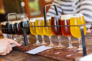 Craft beer tasting flight featuring a variety of beers representing the best beer cities around the world for craft beer lovers.
