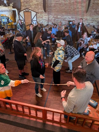 People taking part in the Cheese Curd Pull Competition