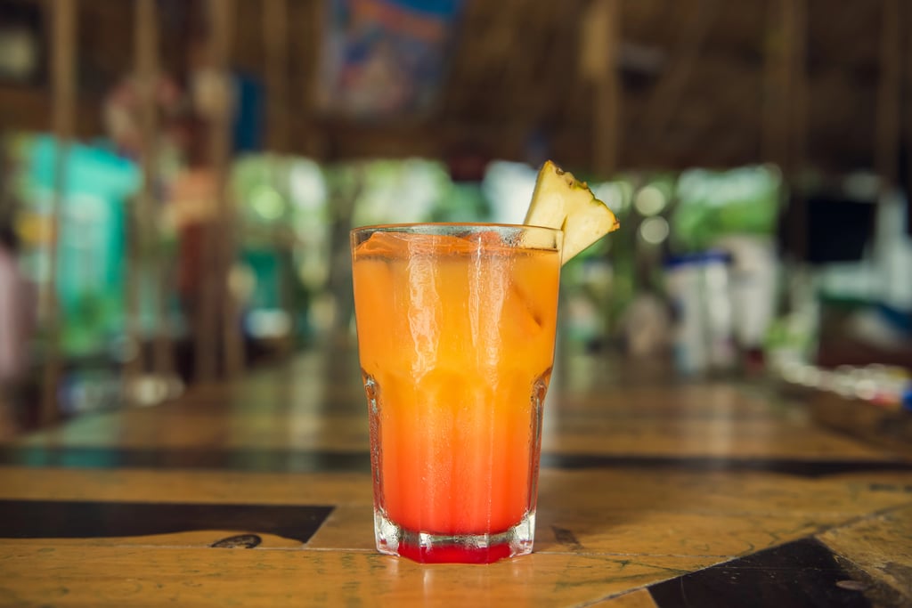 A Pineapple Jalapeño Michelada beer cocktail with pineapple.